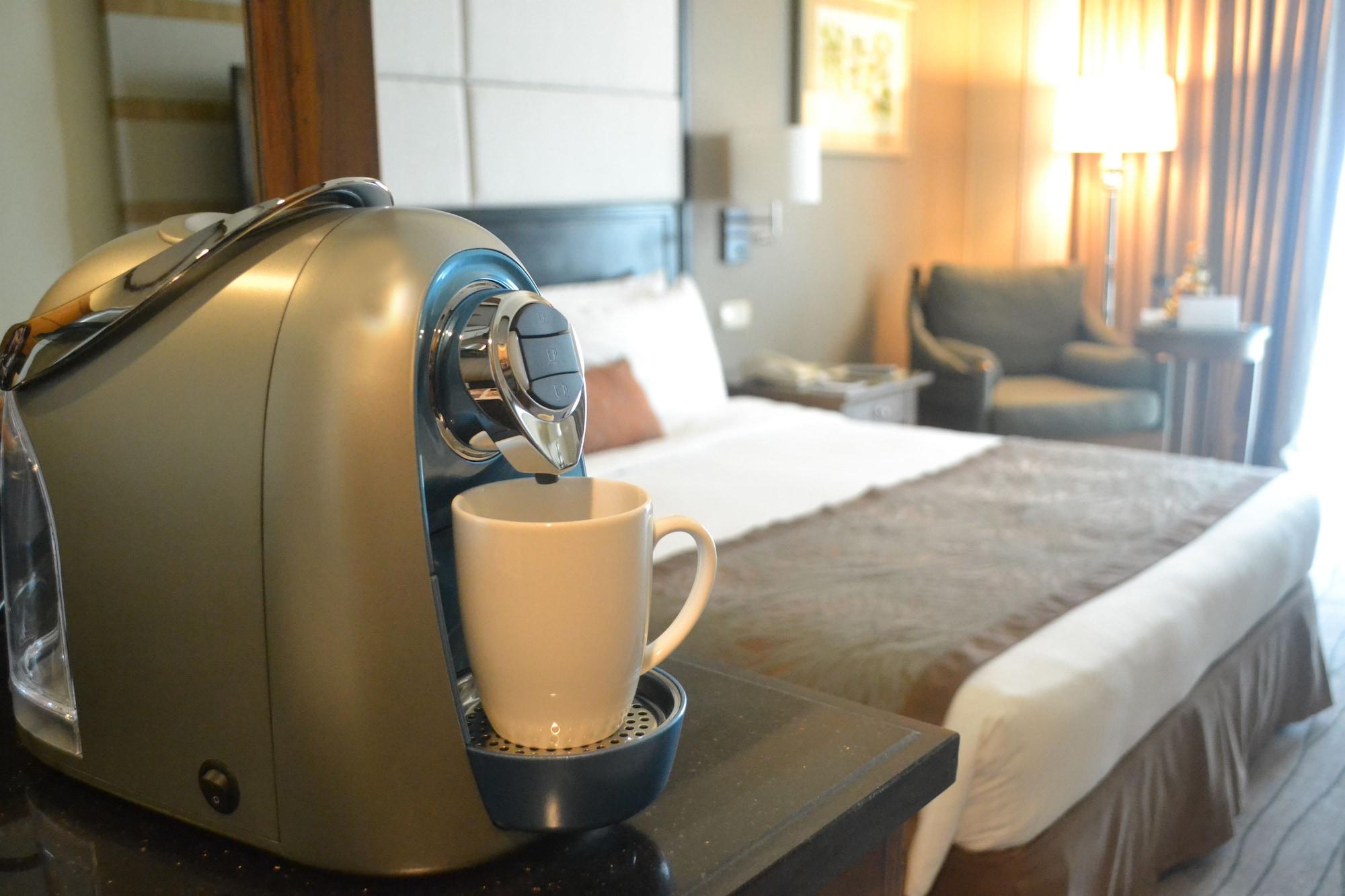 Hotel Marco Polo Davao City Esterno foto A Nespresso machine in a hotel room